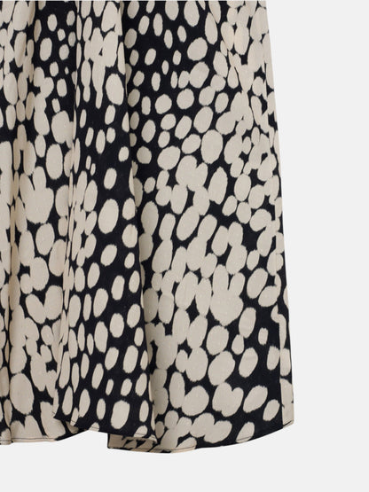 Vestido midi drapeado lunares blanco y negro