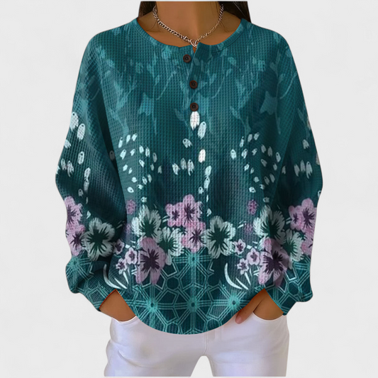 Nora - Suéter en tono petróleo con estampado floral