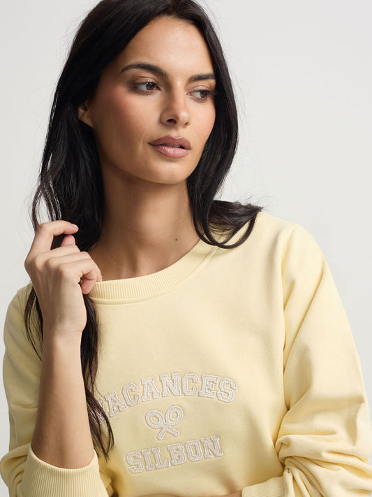Sudadera woman detalle cuerdas amarilla